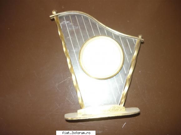 radio incorporat ,fier calcat carbuni din bronz etc ceas romanesc din alama lei